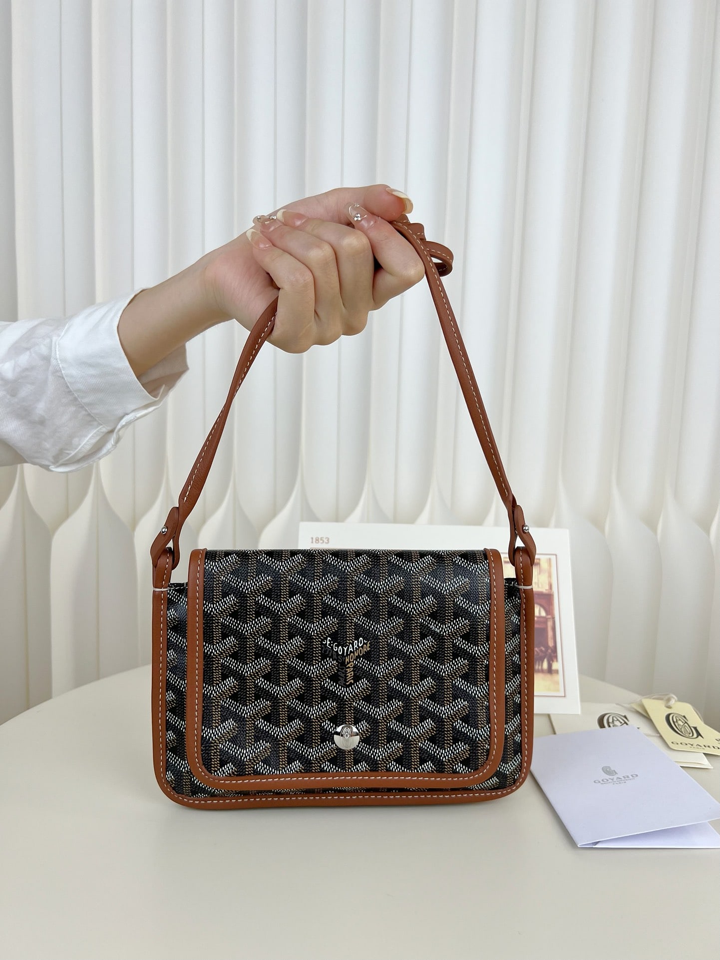 Goyard plumet: The Goyard plumet envelope bag is a lightweight pouch you can easily sling over your shoulder and head out. Despite its slim design with three compartments, it easily holds everyday essentials like yo