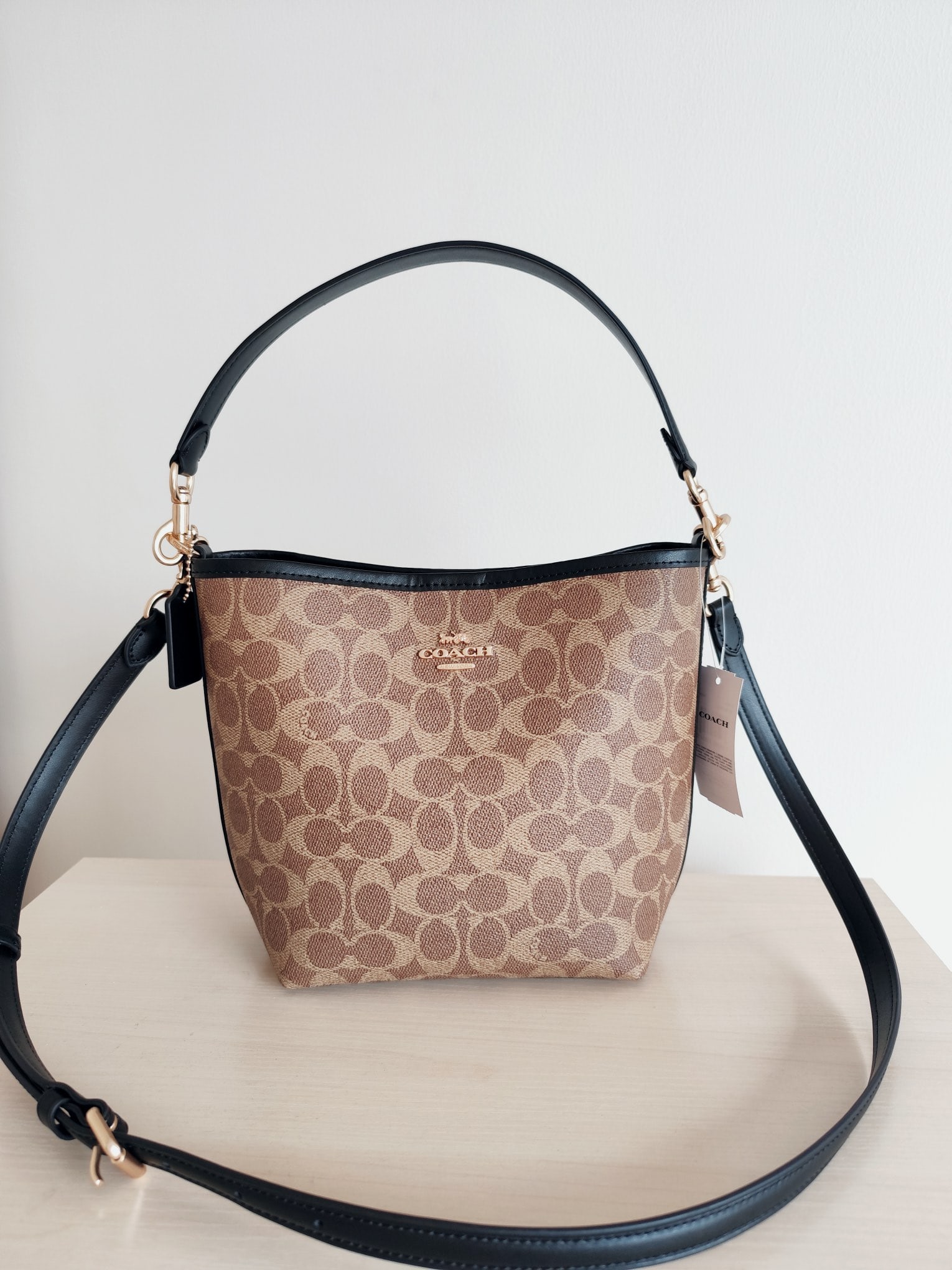 COACH City bucket: The COACH City Bucket series classic monogram bucket bag is made of high-quality cowhide leather with PVC accents- it has a fantastic feel! It can be carried by hand, over the shoulder, or crossbody; 