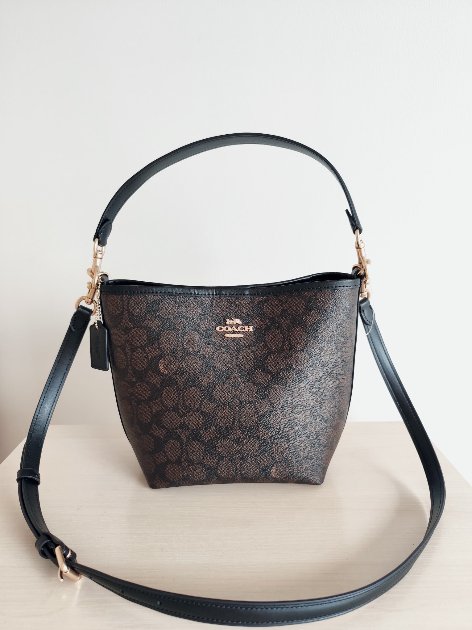 COACH City bucket: The COACH City Bucket series classic monogram bucket bag is made of high-quality cowhide leather with PVC accents- it has a fantastic feel! It can be carried by hand, over the shoulder, or crossbody; 