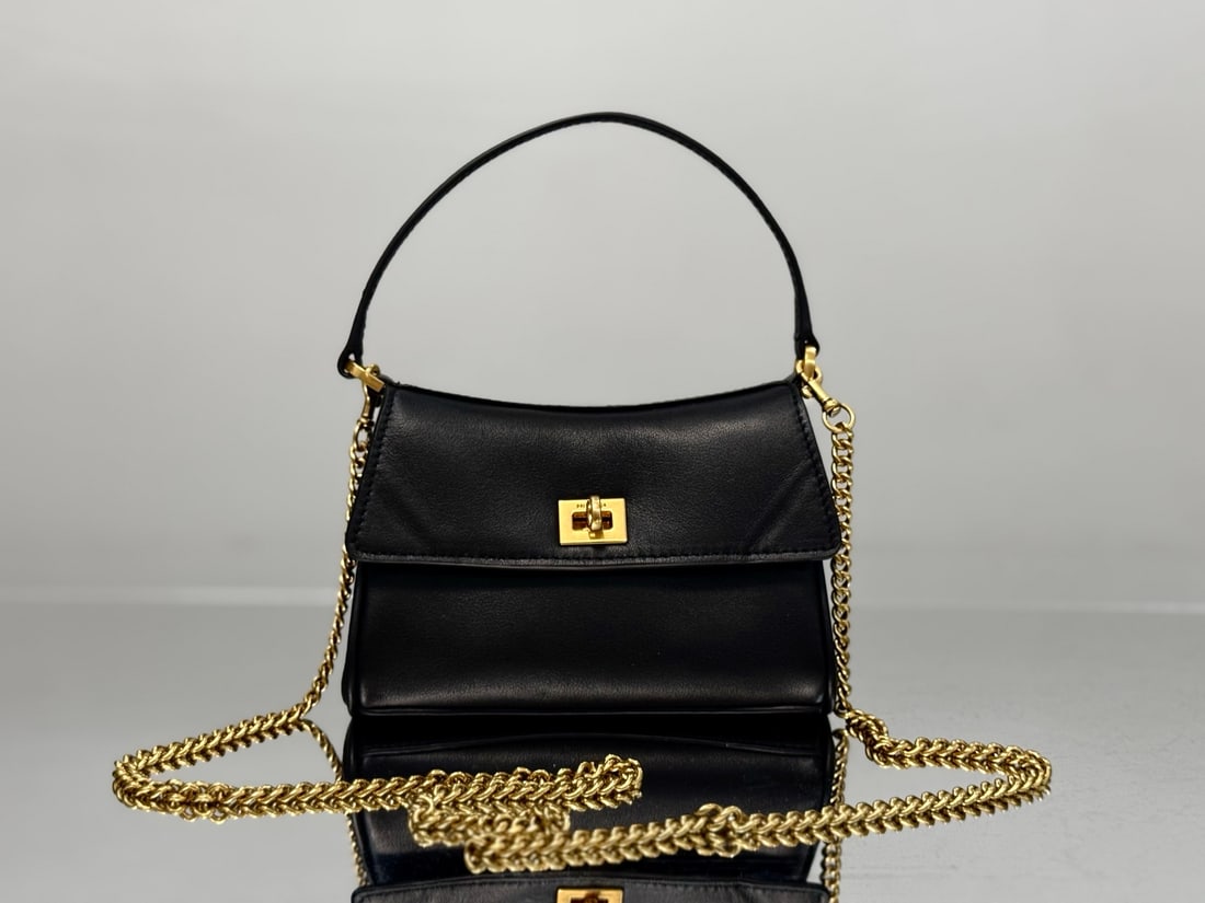 Balenciaga Rodeo: Balenciaga's popular Rodeo series introduces the Nano chain bag. The detachable chain instantly transforms it into an adorable handbag. A must-have small bag with a built-in card slot and ultra-minima