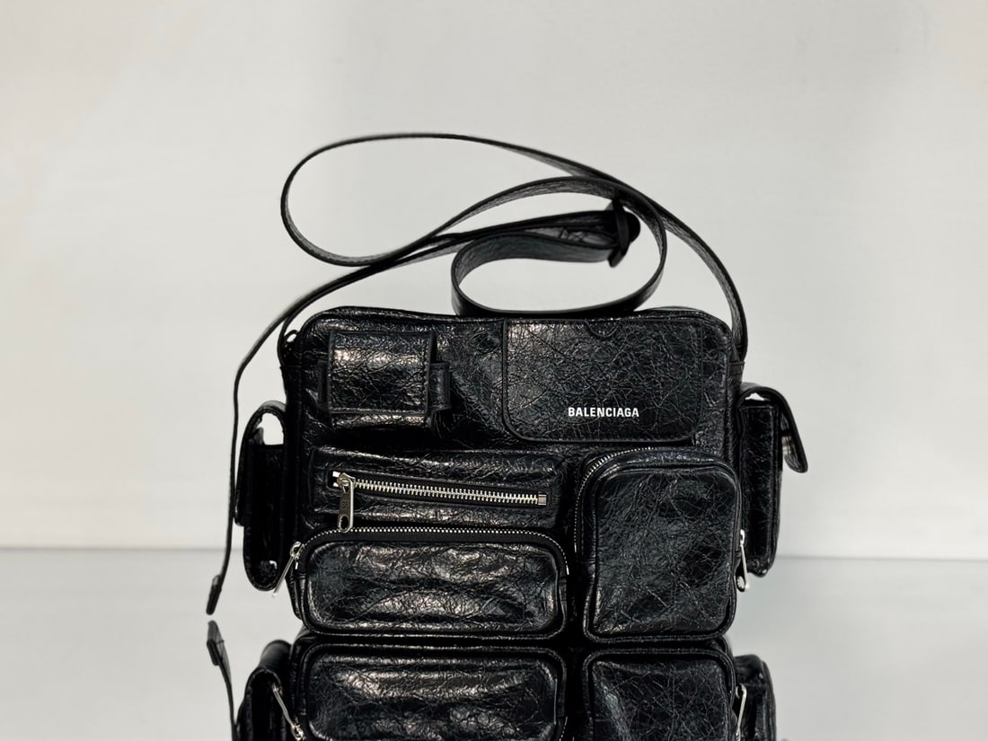 Balenciaga superbusy camera bag: Balenciaga's Spring/Summer 2025 camera bag, the Balenciaga Superbusy Camera Bag, is a must-have item. Made of lambskin with a vintage workwear pocket, this bag is a perfect blend of style and practica