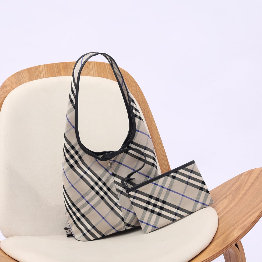 Burberry: The Burberry Hobo tote bag is crafted from an exclusive twill fabric that is both soft and structured, offering a relaxed feel. Its generous capacity allows for effortless style, combining comfort