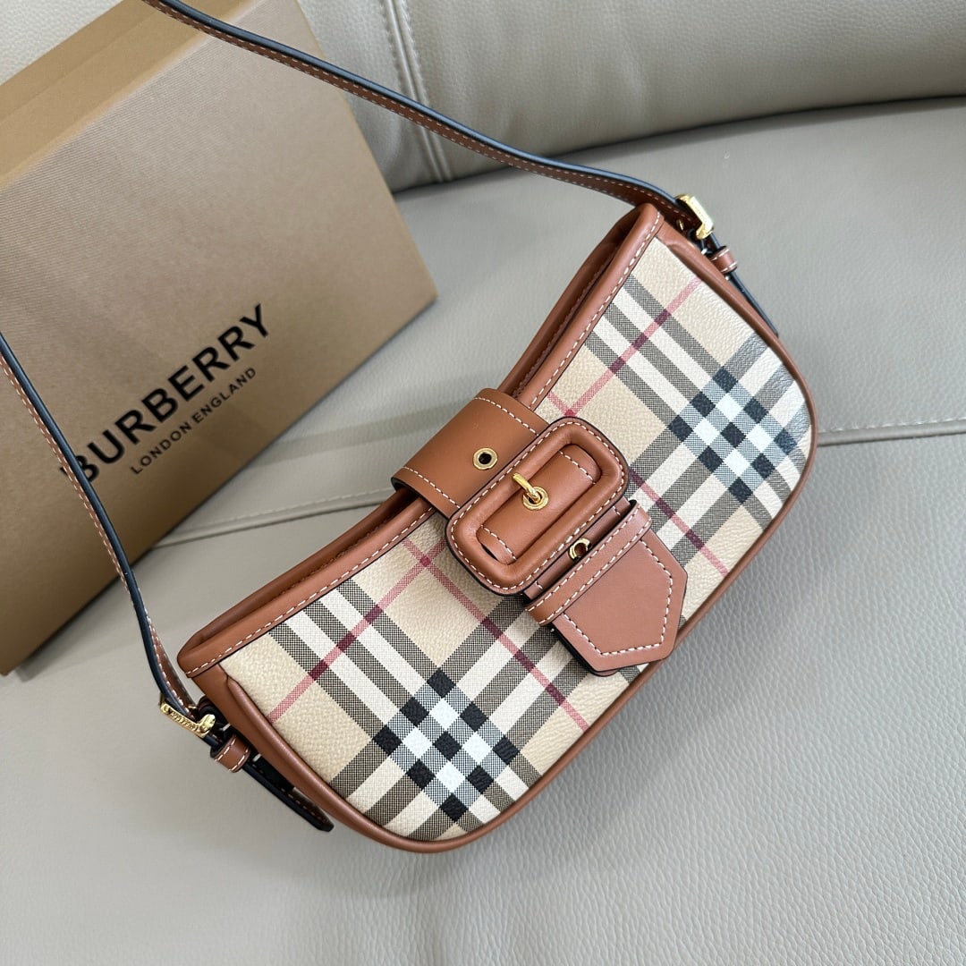 Burberry Burberry: Made in Italy by Burberry, this bag features the iconic Burberry check pattern and a striking drawstring design inspired by the brand's signature trench coat. 26 x 6 x 12 cm Thank you for viewing our