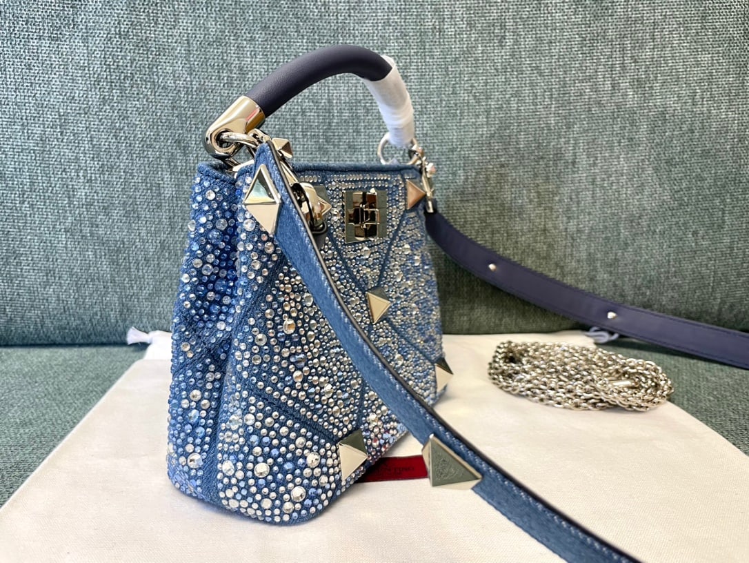 Valentino Romanstud: Star Diamond Series Mini Valentino Romanstud Denim Studded Bag Dimensions: 20 x 15 x 9 cm Thank you for viewing our auction and we look forward to serving you as a valued Gold Standard Auctions custom