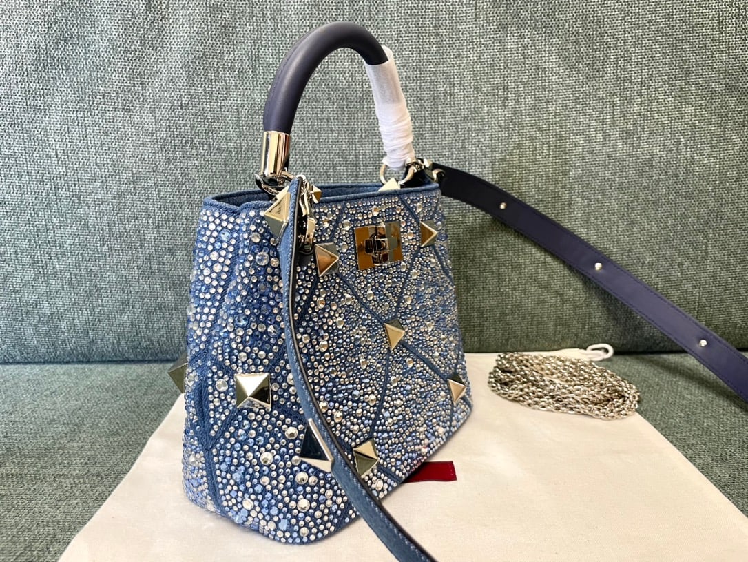 Valentino Romanstud: Diamond Series Medium Valentino Romanstud Denim Studded Bag Dimensions: 21 x 17 x 13 cm Thank you for viewing our auction and we look forward to serving you as a valued Gold Standard Auctions customer