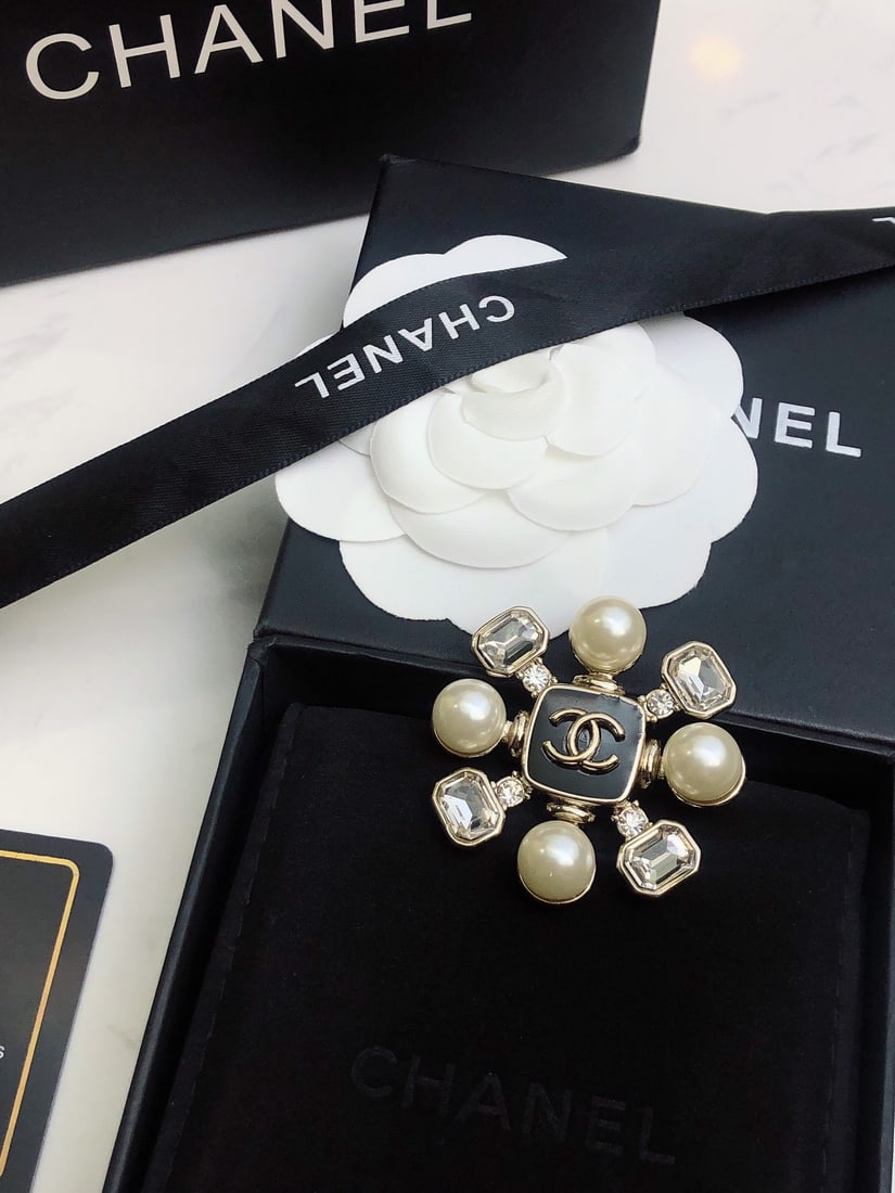 Chanel brooch: Chanel brooch Thank you for viewing our auction and we look forward to serving you as a valued Gold Standard Auctions customer! Each item has been carefully selected to bring quality, character, and