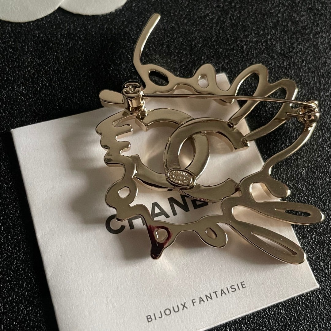 CHANEL double C diamond brooch.: CHANEL double C diamond brooch Thank you for viewing our auction and we look forward to serving you as a valued Gold Standard Auctions customer! Each item has been carefully selected to bring