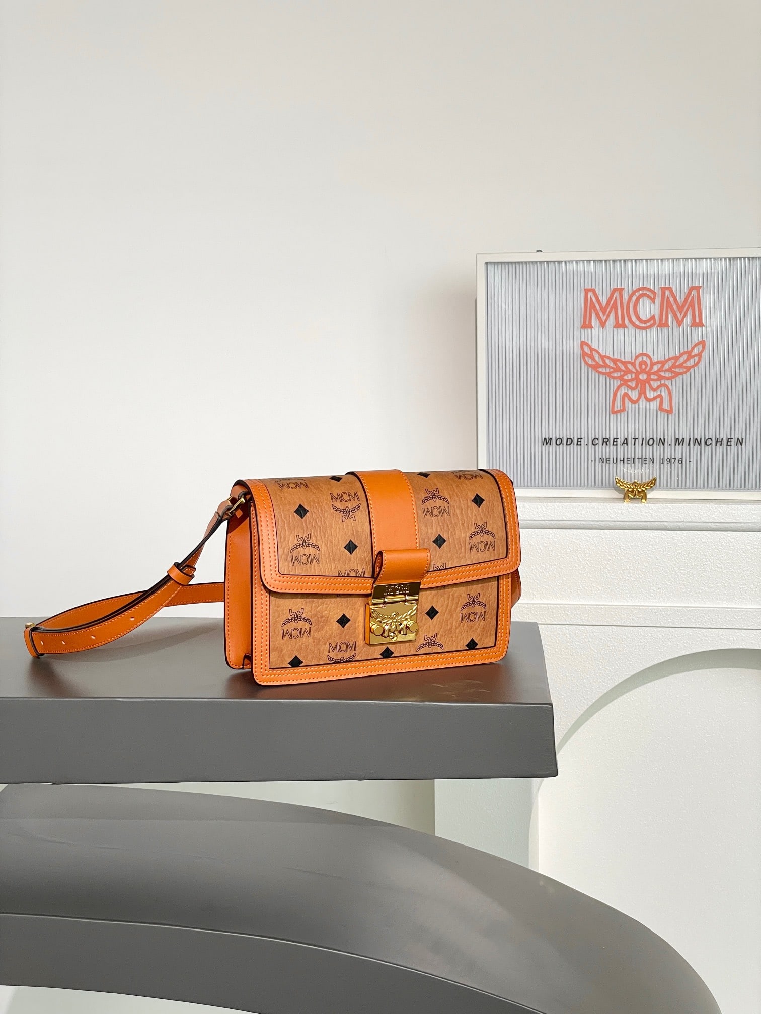 MCM TRACY VISETOS Small Crossbody Shoulder Strap Flap Bag: MCM TRACY VISETOS Small Crossbody Shoulder Strap Flap Bag in Cognac with All-over Monogram Print. This Tracy shoulder bag offers a modern interpretation of the classic Satchel bag. Crafted from the