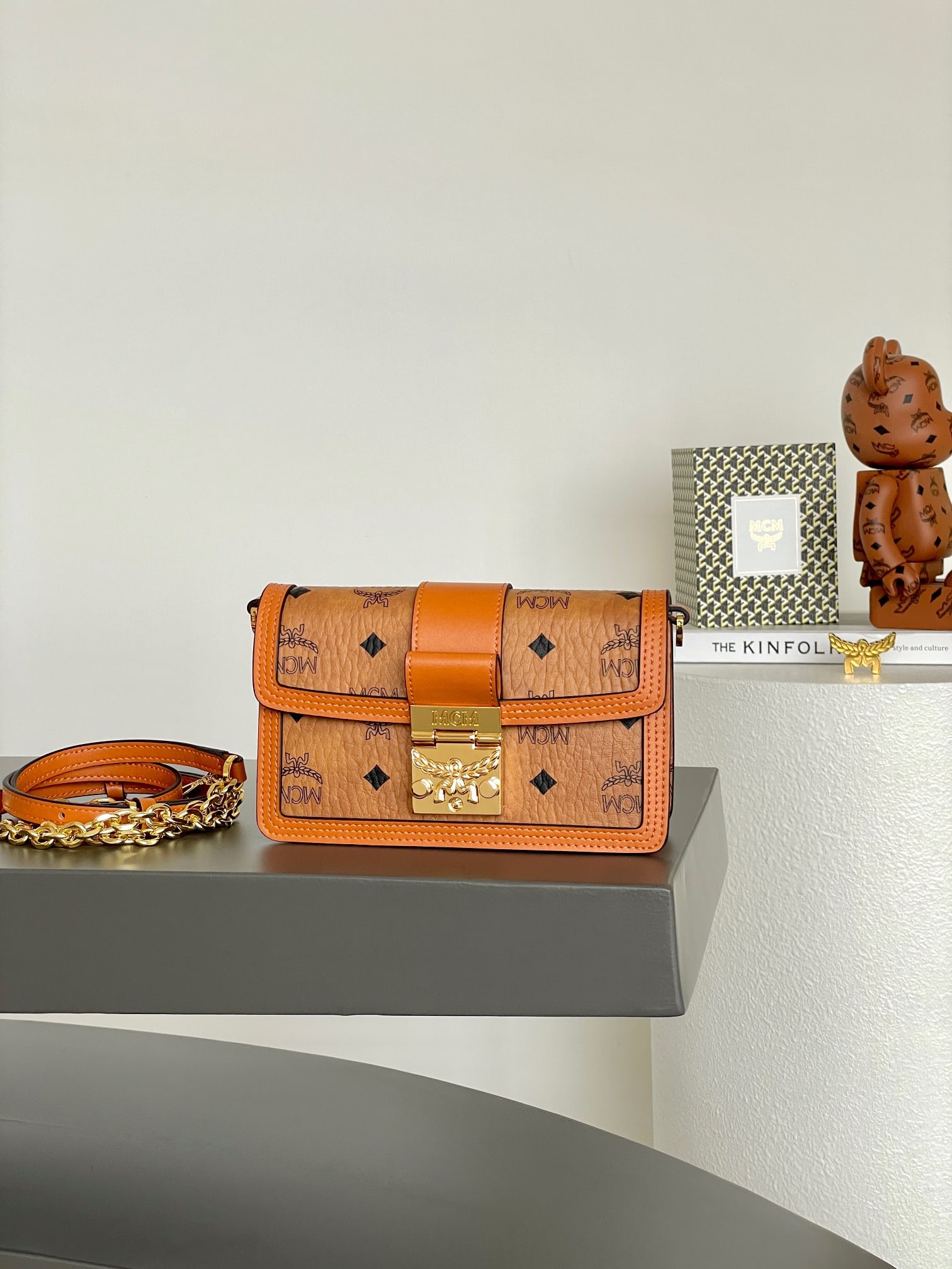 MCM TRACY VISETOS Chain Crossbody Bag: MCM TRACY VISETOS Chain Crossbody Bag in Classic Cognac. This Tracy crossbody bag is crafted from Visetos and outlined in Vachetta leather. The rustic interior features card slots and a zippered pocke