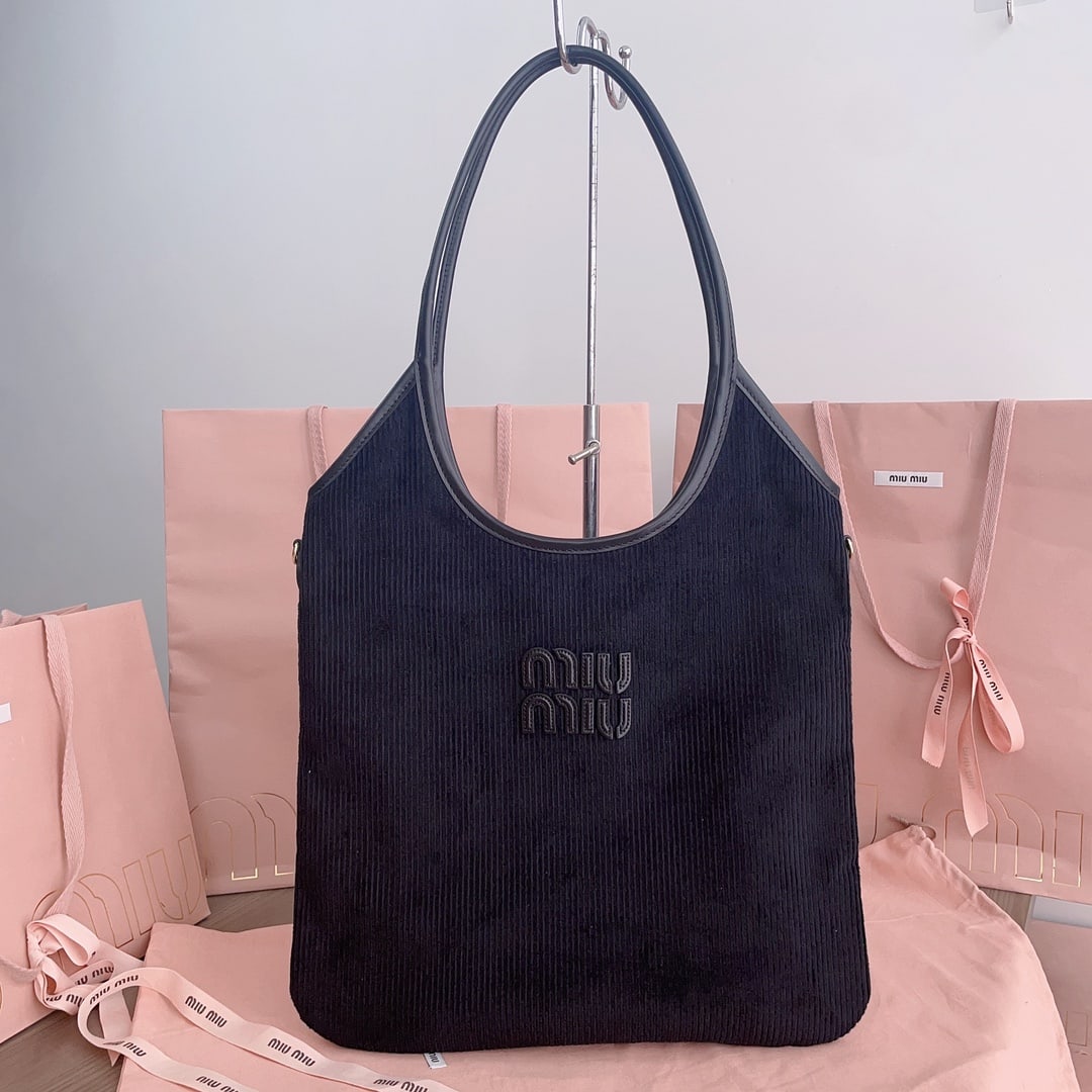 MIUMIU: MIUMIU 35 X 40CM Thank you for viewing our auction and we look forward to serving you as a valued Gold Standard Auctions customer! Each item has been carefully selected to bring quality, character, an