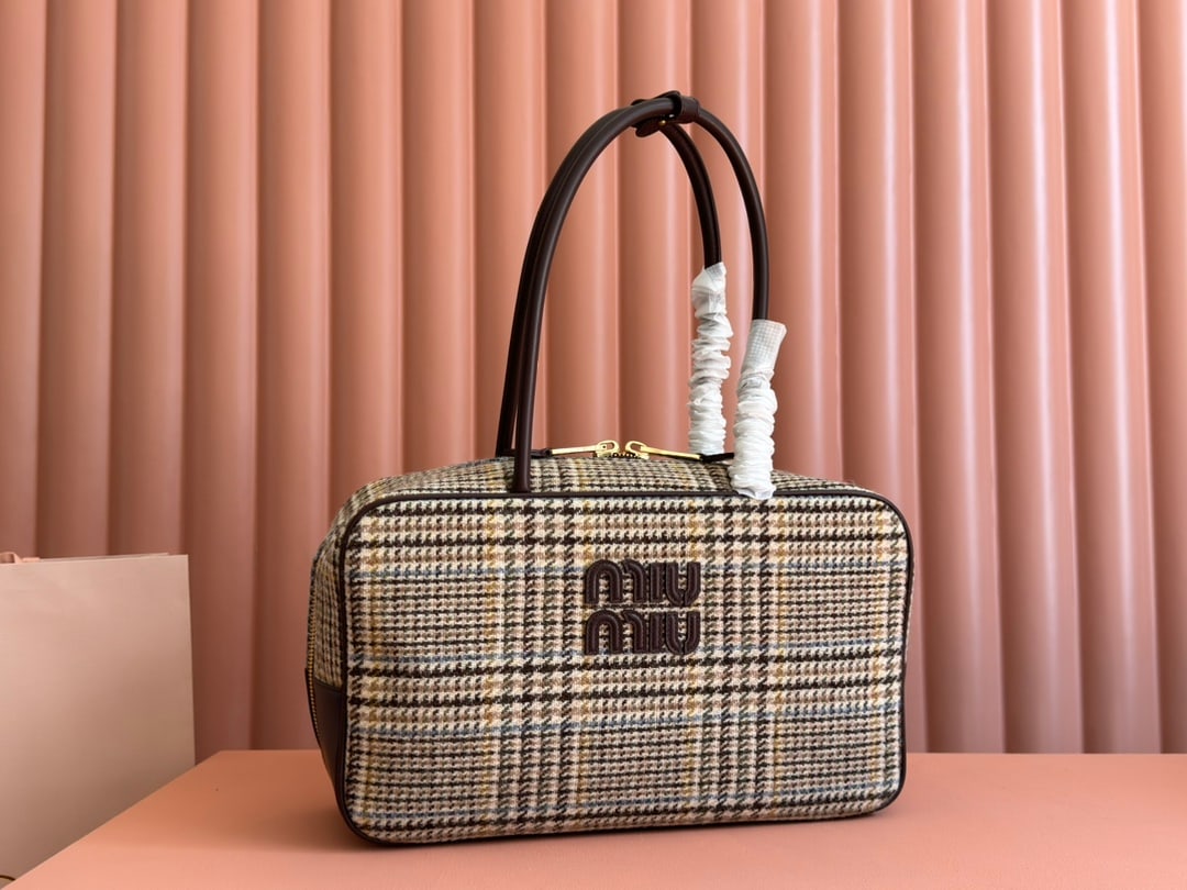 MIUMIU: MIUMIU 34 X 23 X 12CM Thank you for viewing our auction and we look forward to serving you as a valued Gold Standard Auctions customer! Each item has been carefully selected to bring quality, characte