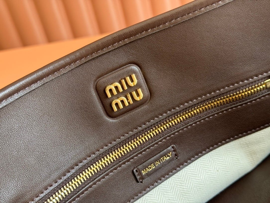 MIUMIU: MIUMIU 31 X 40 X 13CM Thank you for viewing our auction and we look forward to serving you as a valued Gold Standard Auctions customer! Each item has been carefully selected to bring quality,