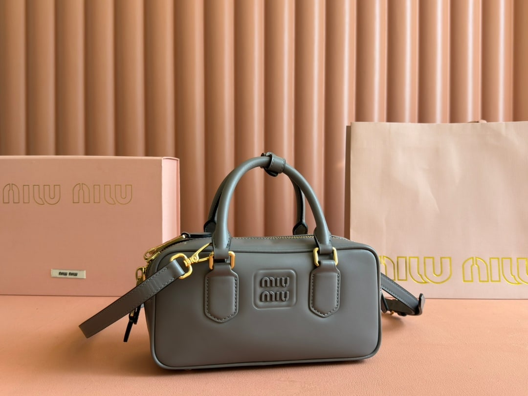 MIUMIU: MIUMIU 22 X 10.5 X 7.5CM Thank you for viewing our auction and we look forward to serving you as a valued Gold Standard Auctions customer! Each item has been carefully selected to bring quality, chara