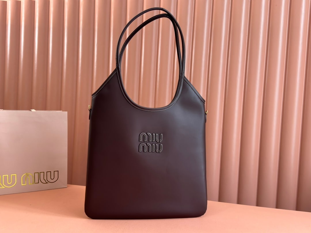 MIUMIU: MIUMIU 35 X 40CM Thank you for viewing our auction and we look forward to serving you as a valued Gold Standard Auctions customer! Each item has been carefully selected to bring quality, character,