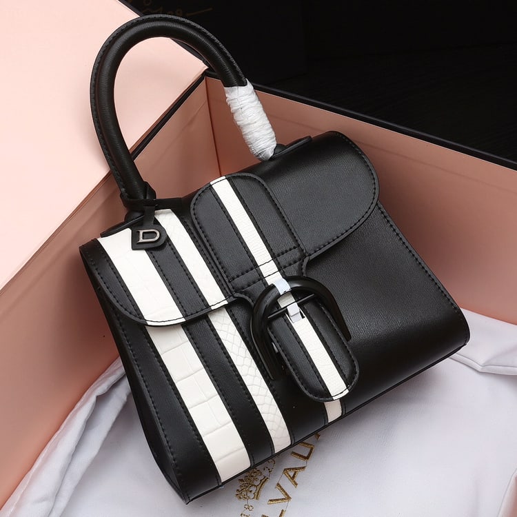 Delvaux BL: Belgian Delvaux BL series black box leather bag with white lizard, crocodile, and snake prints- a legendary piece spanning two centuries! Full of vintage charm, it features a detachable strap for easy