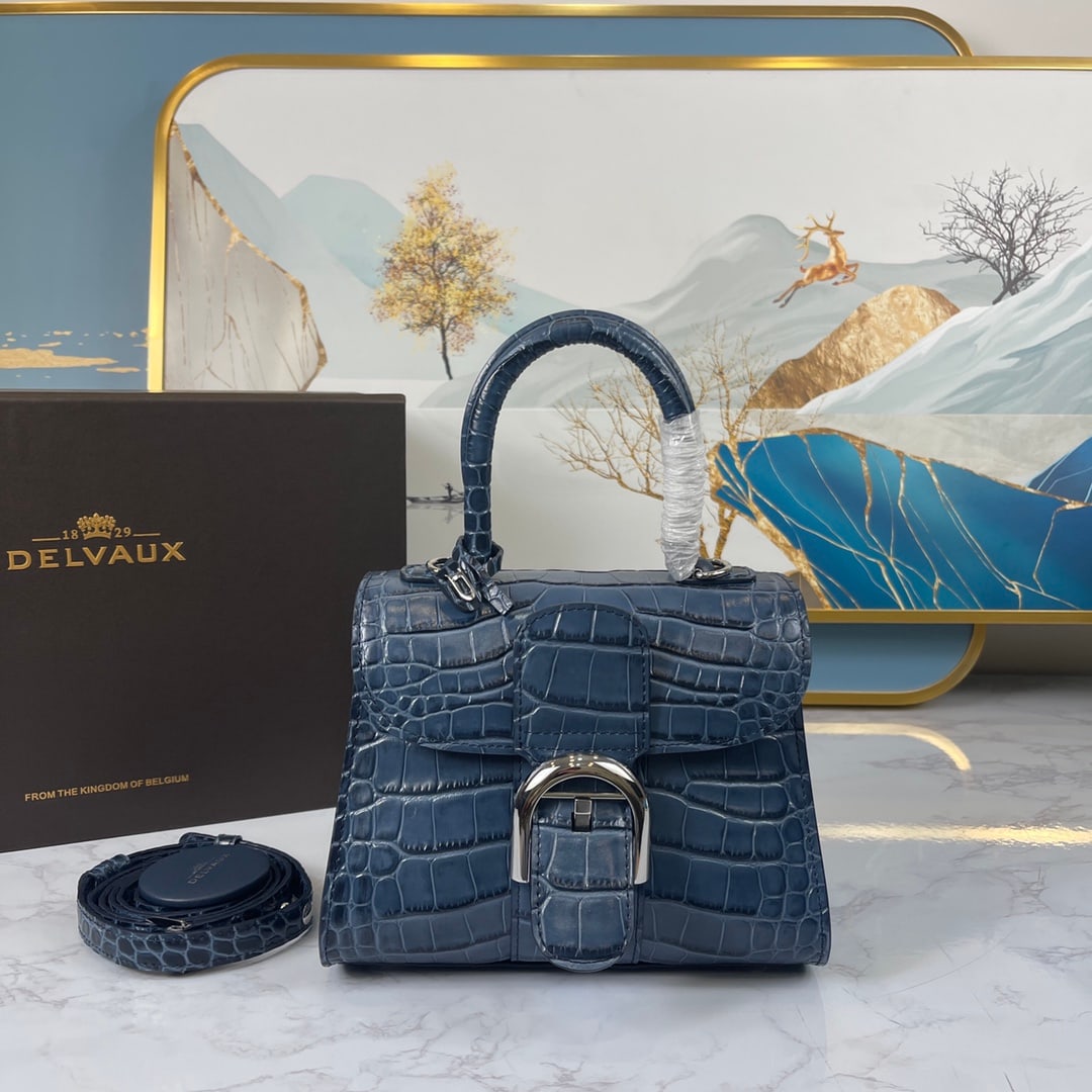 Delvaux: Crocodile-Patterned Mini Bag, size 20 x 10 x 16 cm. Another timeless classic from Belgian Delvaux Brillant. These embossed crocodile bags are rare and precious; each one is a sculptural work of art, e
