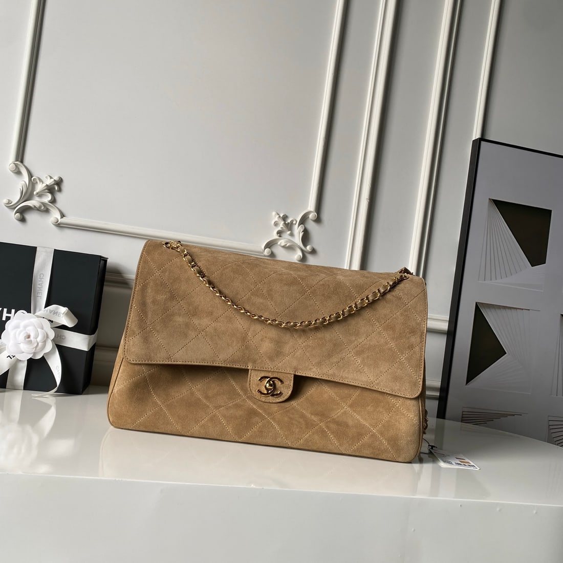 CHANEL Classic Flap (CF): CHANEL Classic Flap (CF) Suede with a matte, soft-focus finish. Features a light gold double C buckle and a leather-threaded metal chain shoulder strap. A retro, relaxed look that's timeless and