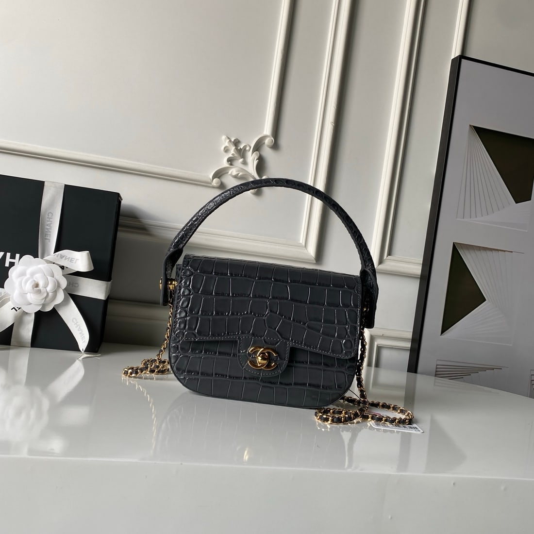 CHANEL Crocodile Embossed Saddle Bag: CHANEL Crocodile-Embellished Saddle Bag Metiers d'Art glossy crocodile-embossed calfskin leather with curved handles and a leather-stitched metal chain. It can be worn under the arm or crossbody, main