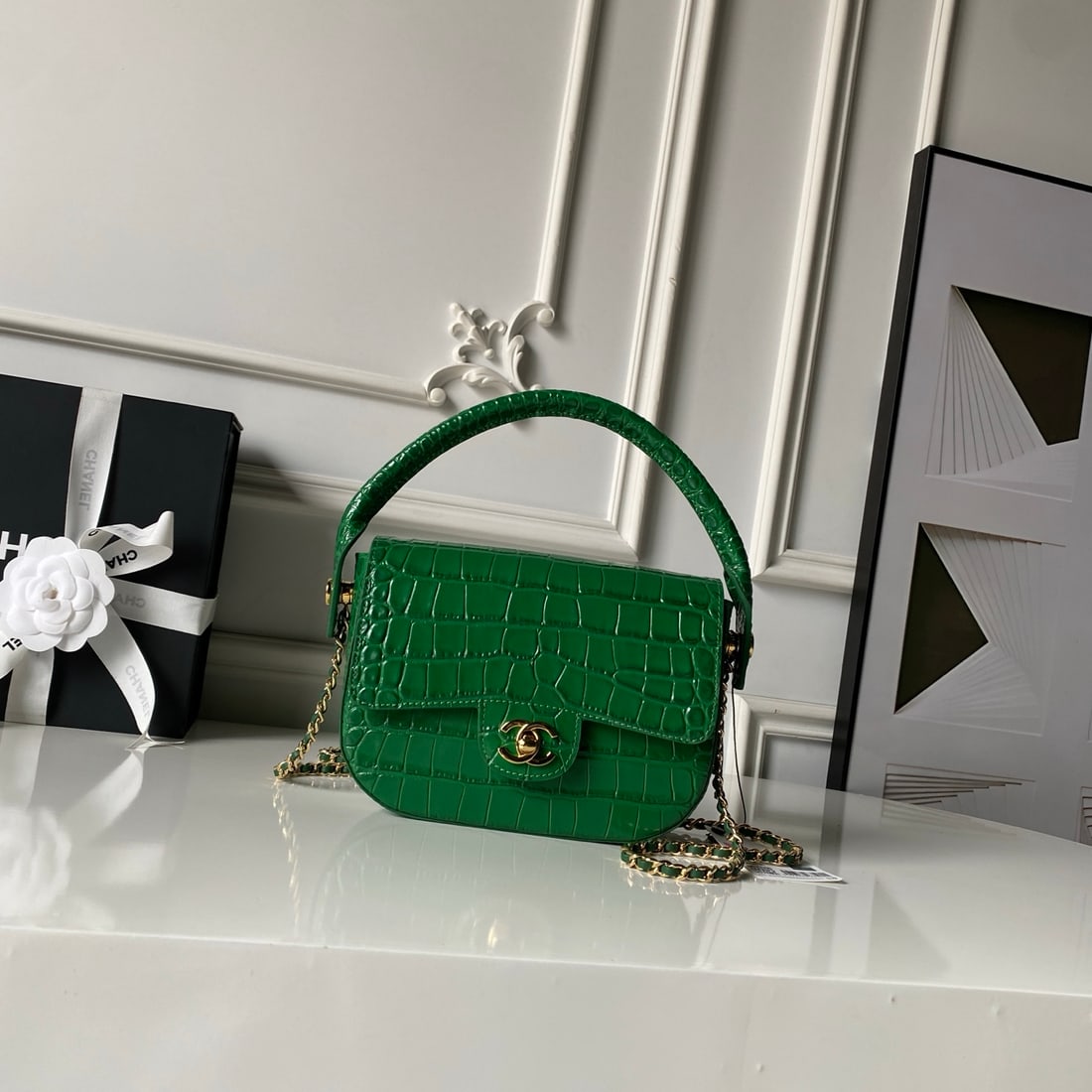 CHANEL Crocodile Embossed Saddle Bag: CHANEL Crocodile-Embellished Saddle Bag Metiers d'Art glossy crocodile-embossed calfskin leather with curved handles and a leather-stitched metal chain. It can be worn under the arm or crossbody, main