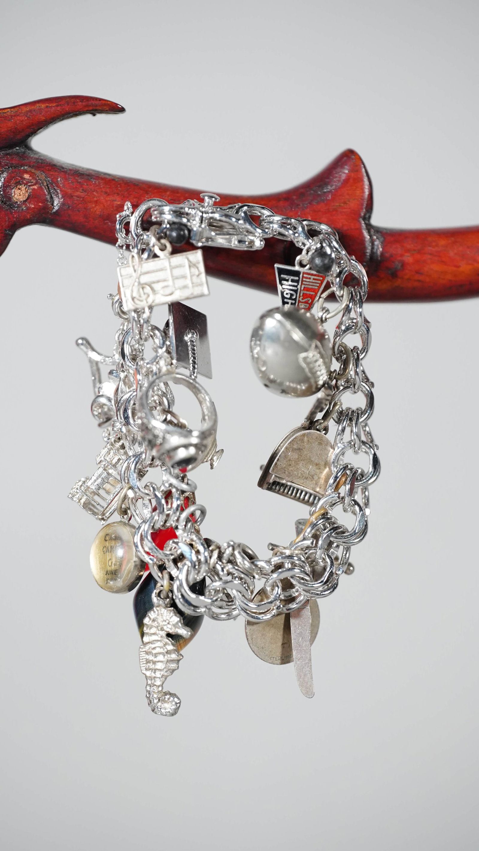 Special Customized Serling Silver Bracelet: A Very Specially Customized Silver Bracelet with Many Small Silver Made Pendants Decoration. Silver Marked, (Stand Not Included). Bracelet size: 7"1/2L, Weight: 76g