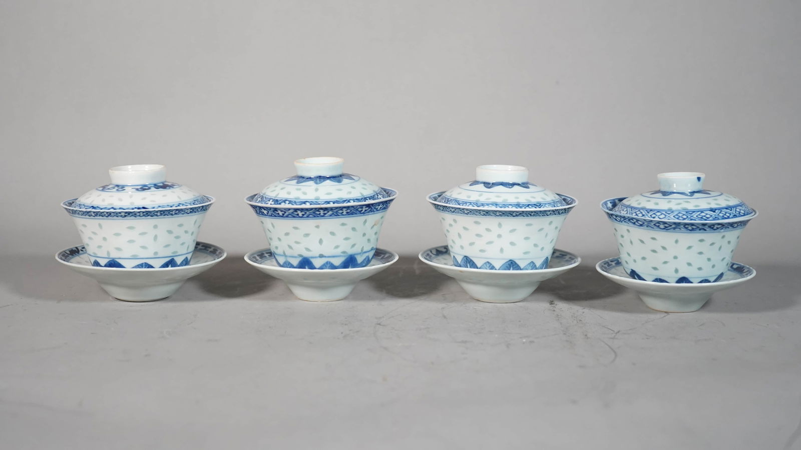 Set of 4 Chinese Antique Blue and White Rice Pattern Porcelain Tea Cups Set: Set of 4 Traditional Chinese Blue and White Rice Pattern Porcelain Tea Set (Cup, Lid & Saucer), Four Tea Cups and Three Lids has Mark, Two Saucer has Mark; Lid Size: 3"3/4 Diameter; Cup Size: 2"1/4H x