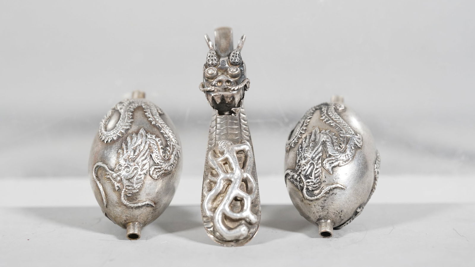 Pair of Sterling Silver Dragon Carving Beads and A Silver Dragon Head Belt Hook (1 of 6)
