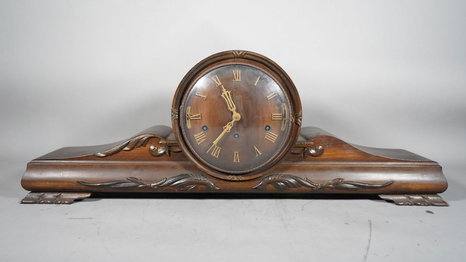Vintage "Urgos" Art Deco Long Wooden Mantel Clock with Key: Vintage "Urgos" Art Deco Long Wooden Mantel Clock with Key. Size: 29"1/4L x 5"1/2W x 10"1/2H
