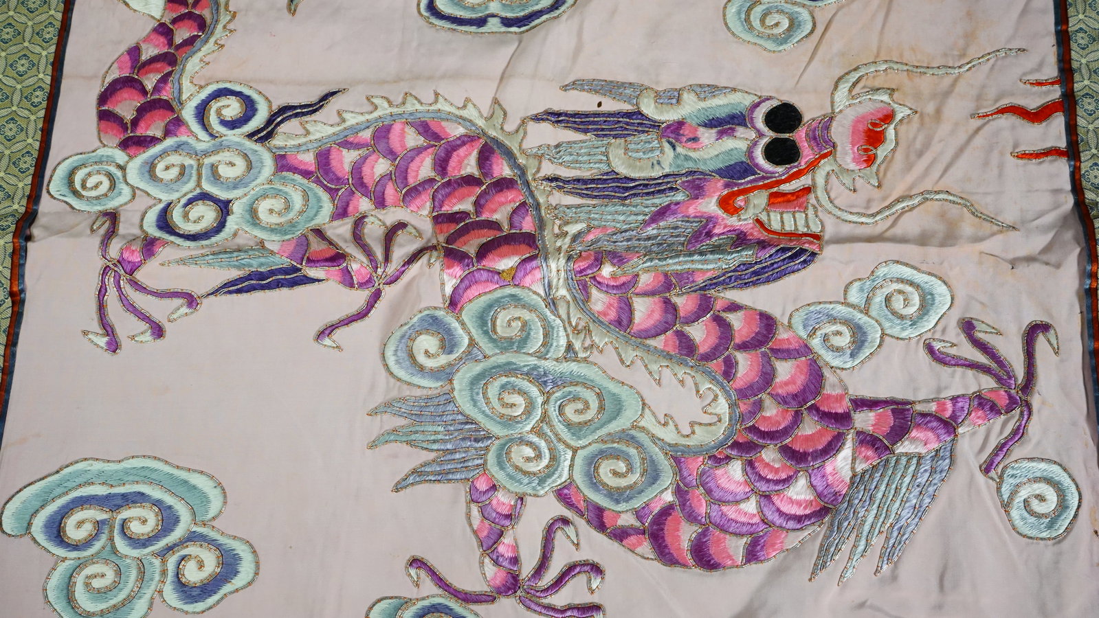 Vintage Chinese Embroideries with Dragon: Vintage Chinese Embroideries with Dragon. This decorative embroideries authentic imported from The Peoples Republic of China, date around 1862-1874, Pink base and good condition with stains. Size: 24"