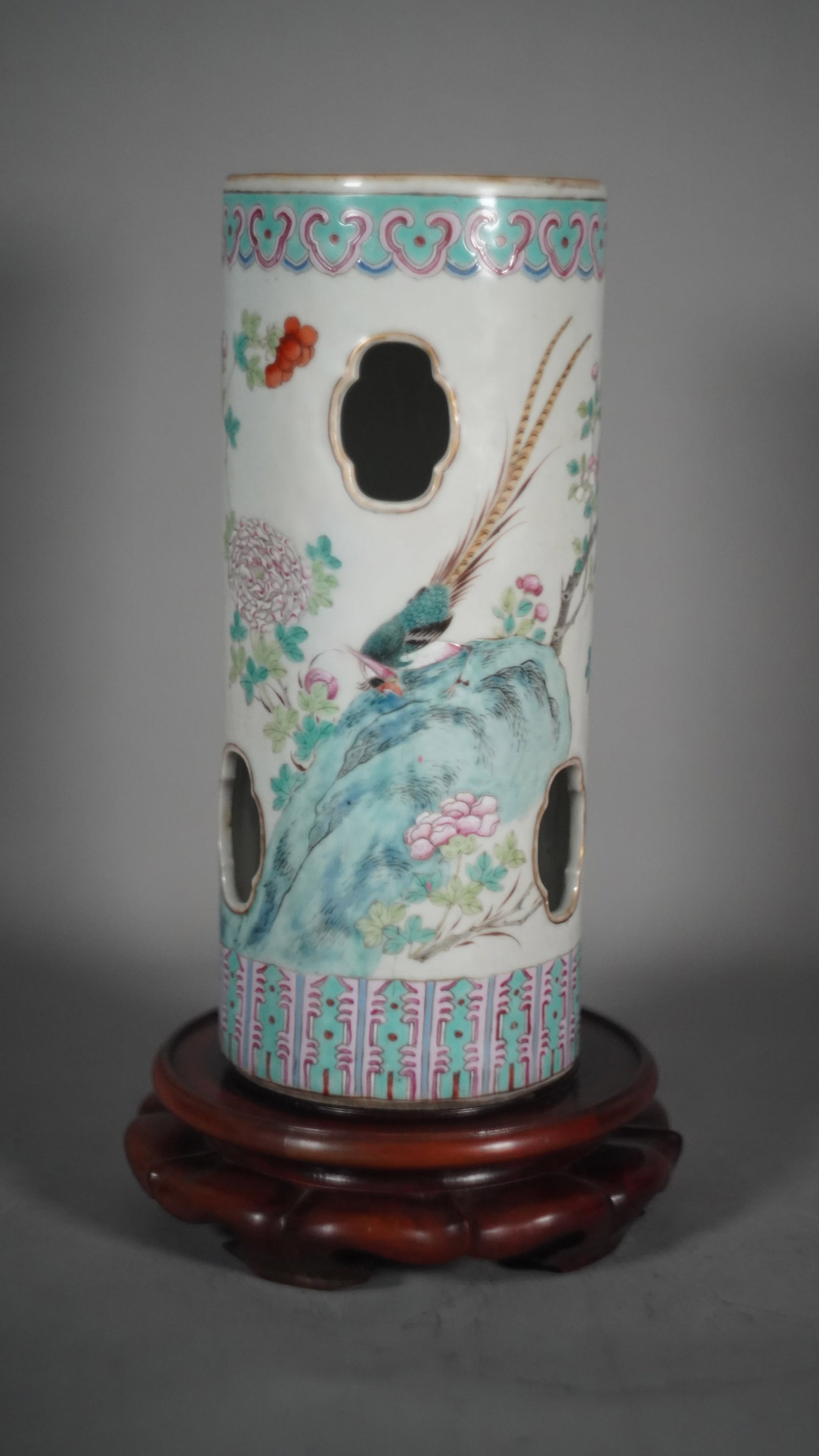 A Chinese Famille Rose Porcelain Hat Stand With Quatrefoil Cutouts: A Chinese Famille Rose Porcelain Hat Stand With Quatrefoil Cutouts. Hand-painted with phoenix in a garden of peonies. Height 11"1/2, Diameter 4"3/4, (Stand Not Included)