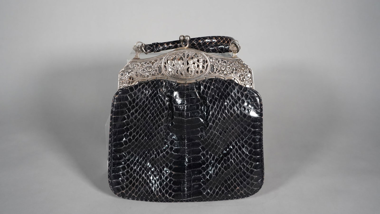 Rare Vintage Black Snakeskin 800 Silver Top Frame Luxurious Lady Purse: Rare Vintage Black Snakeskin 800 Silver Luxurious & Elegant Lady Purse. Children figures statue and two flower baskets, very detailed, also with genuine leather interior. Measures approx.: 8" x 8", Ex