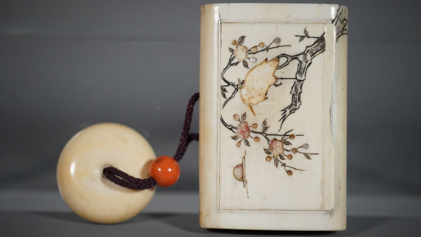 Lovely Old Antique Japanese Netsuke Bone Carved & Inlaid Card Case with Round Pendant: Lovely Old Antique Japanese Netsuke Bone Carved & Inlaid Card Case with Round Pendant and A Red Coral Bead. This card case is missing inlaid pieces (Bird, Flowers and Sun or Moon, so which appears to 