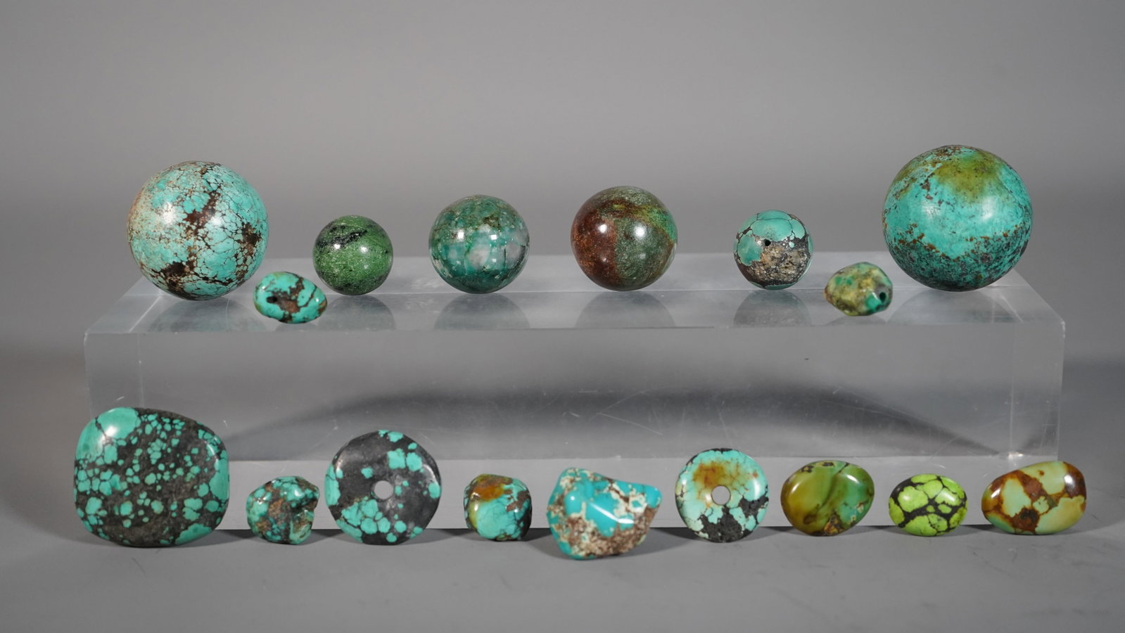 Group of 17 Old Turquoise Beads: Group of 17 Old Turquoise Beads, Several beads has drilled. Two large round beads 35mm & 36.1mm; Four small round beads 19.4mm/20.2mm/25.4mm/26.7mm; Two round disc pendants 22.2mm and 27mm; A large sq