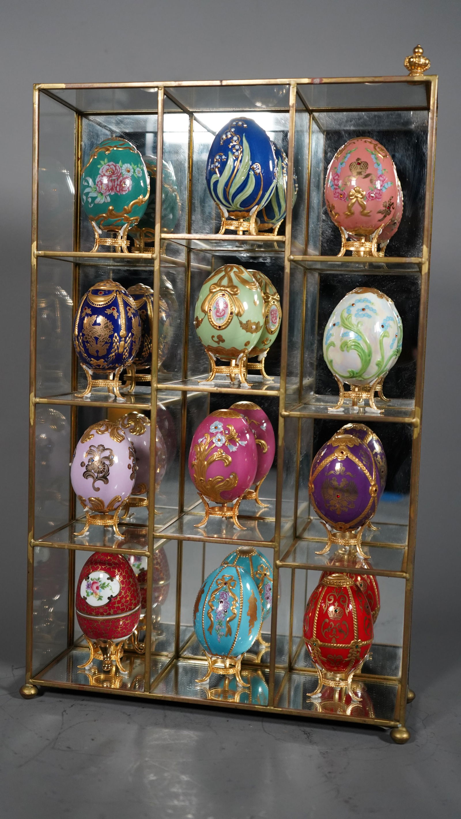 Group of 12 Exquisite Hand-Painted Porcelain Imperial Easter Eggs with Display Cabinet & "The (1 of 8)