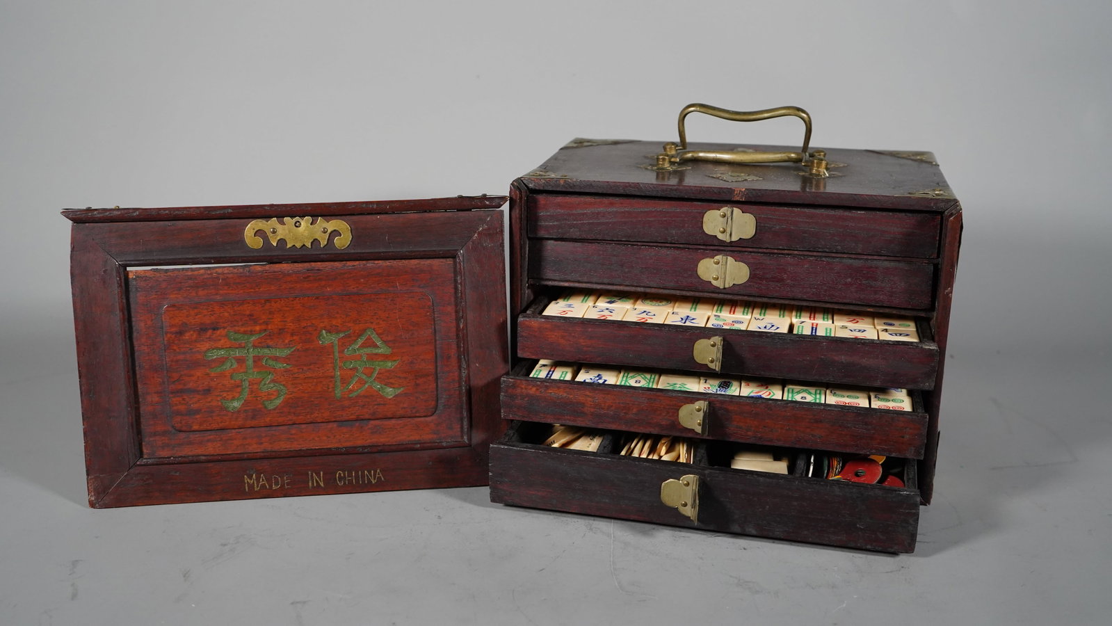 Antique Chinese Bone & Bamboo Mahjong Set: Vintage Chinese Bone & Bamboo Mahjong Set, Rectangle Wood Box with Pierced Brass Corner and Four Slide Drawers Cases. 9"1/4L x 6"1/2W x 6"1/2H; In good condition, (Stand Not Included)