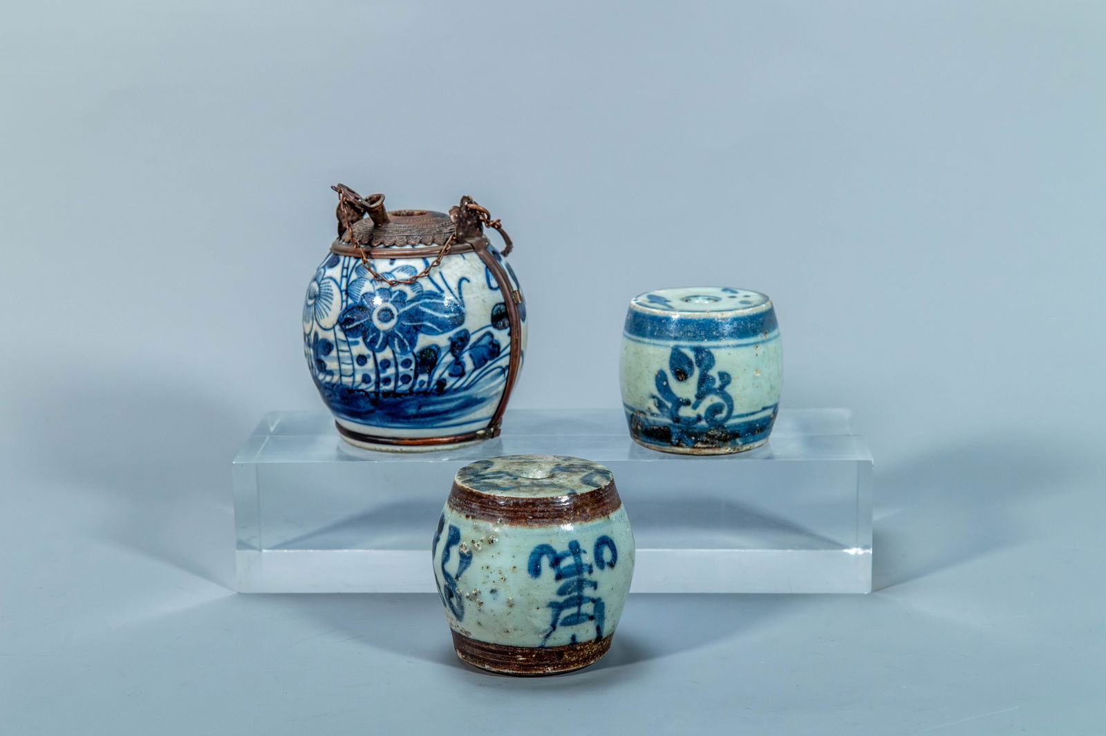 Group of 3 Old Antique Chinese Blue & White Ceramic Paper Weight & Metal-Mounted Oil Lamp: Group of 3 Old Antique Chinese Blue & White Drum Shaped Ceramic Paper Weight(Probably Ming Dynasty) & Metal-Mounted Blue & White Porcelain Oil Lamp. Two Drum ceramic paper weight 2"H x 2"W and 2"1/2H