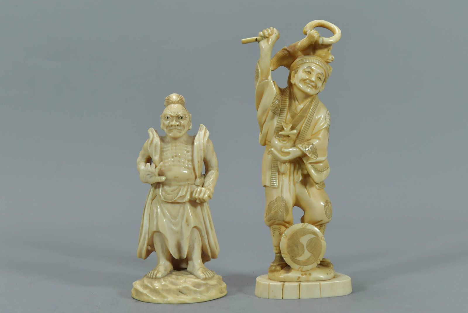 Two Old Vintage Japanese Hand-Carved Bone Figure Statues: Two Old Vintage Japanese Hand-Carved Bone Figure Statues. 4"1/2Tall and 6"Tall; In good condition, (Stand Not Included)