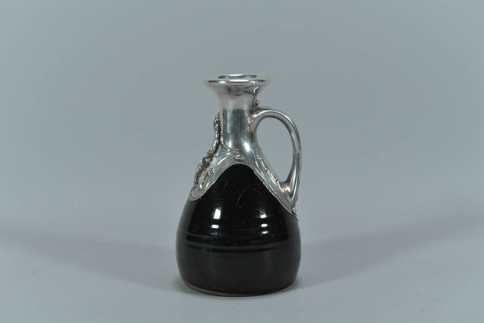 Vintage Sterling Silver Overlay Black Glazed Porcelain Decanter: Vintage Sterling Silver Overlay Black Glazed Porcelain Decanter. Measures approx. 5"H x 3"W, Total weight 213.6g; In good condition, (Stand Not Included)