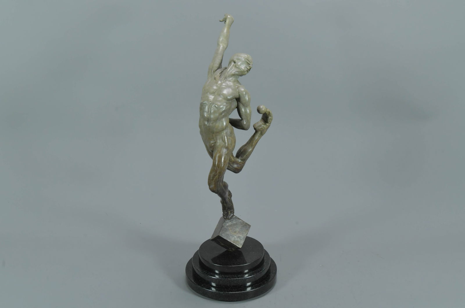Signed Bronze Sculpture "Leap of Faith" by American Artist Richard MacDonald, Limited Edition: Signed Bronze Sculpture "Leap of Faith" by American Artist Richard MacDonald, Limited Edition (480/950), Rotating Marble Base. Total tall 19"; The sculpture was mounted to a black marble base, In perf