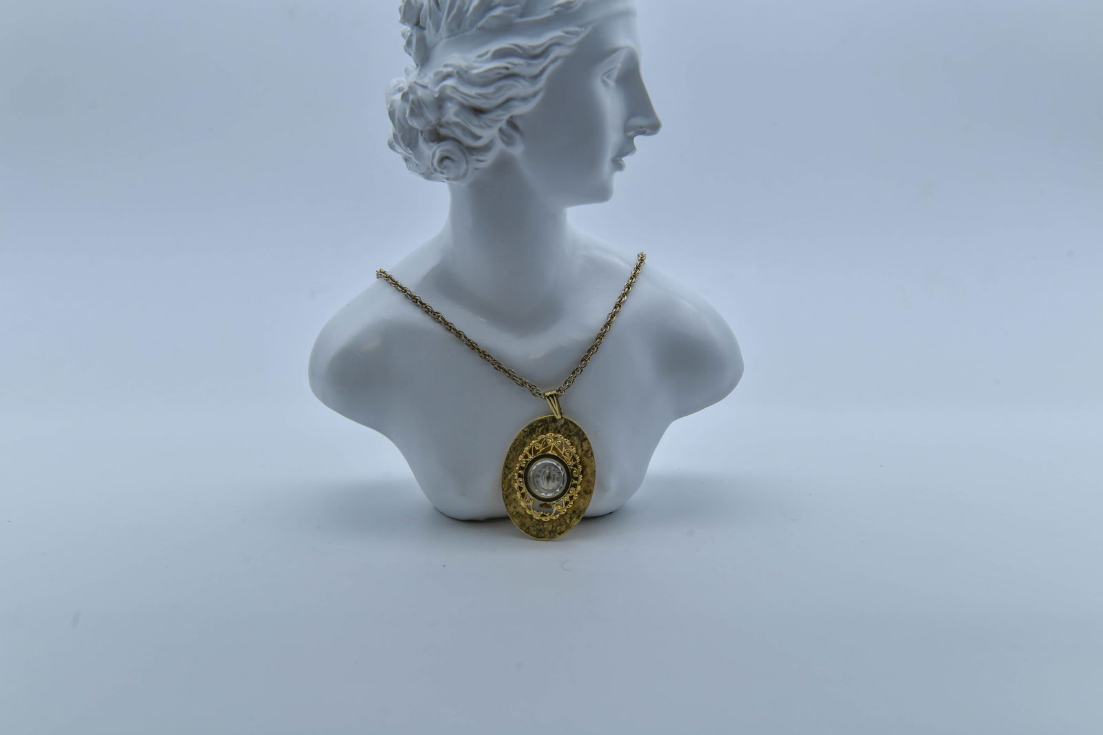 Vintage Gold-Tone Pendant Watch by LINZ Swiss: Vintage Gold-Tone Pendant Watch by LINZ, 17 Jewels, Antimagnetic Unbreakable Mainspeing, Swiss. Watch pendant 1"3/4 x 1"1/4; Chain length 12"; In good overall condition, with normal wear, (Stand Not I