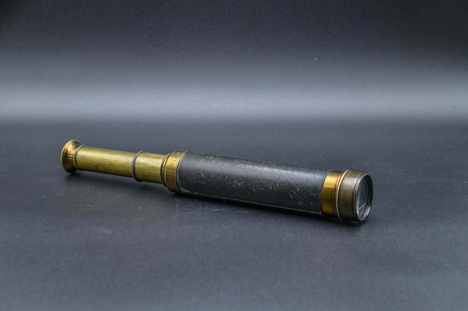 Antique French Leather Wrapped Brass Nautical Telescope: Antique French Leather Wrapped Brass Nautical Telescope. The brass body with an indistinctly etched inscription, partially legible as "J.M. ULRICH. 303 Whitney Ave.", possibly a personal name and addr