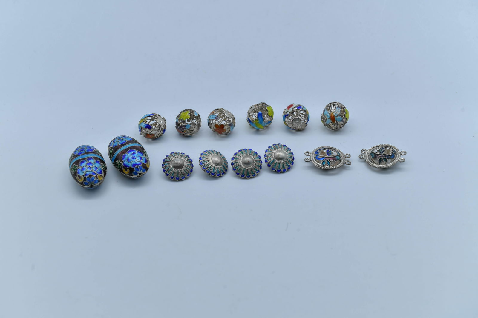 Lot of 14 Vintage Silver-Tong Enamel Decorated Ornaments: Lot of 14 Vintage Silver-Tone Enamel Decorated Ornaments. 1)A pair of olive-shaped ornaments, 35mm x 20.4mm; 2)Lot of 6 filigree enamel beads, 16mm; 3)Lot of 4 disc-shaped enamel beads, 12.4mm; 4)Two