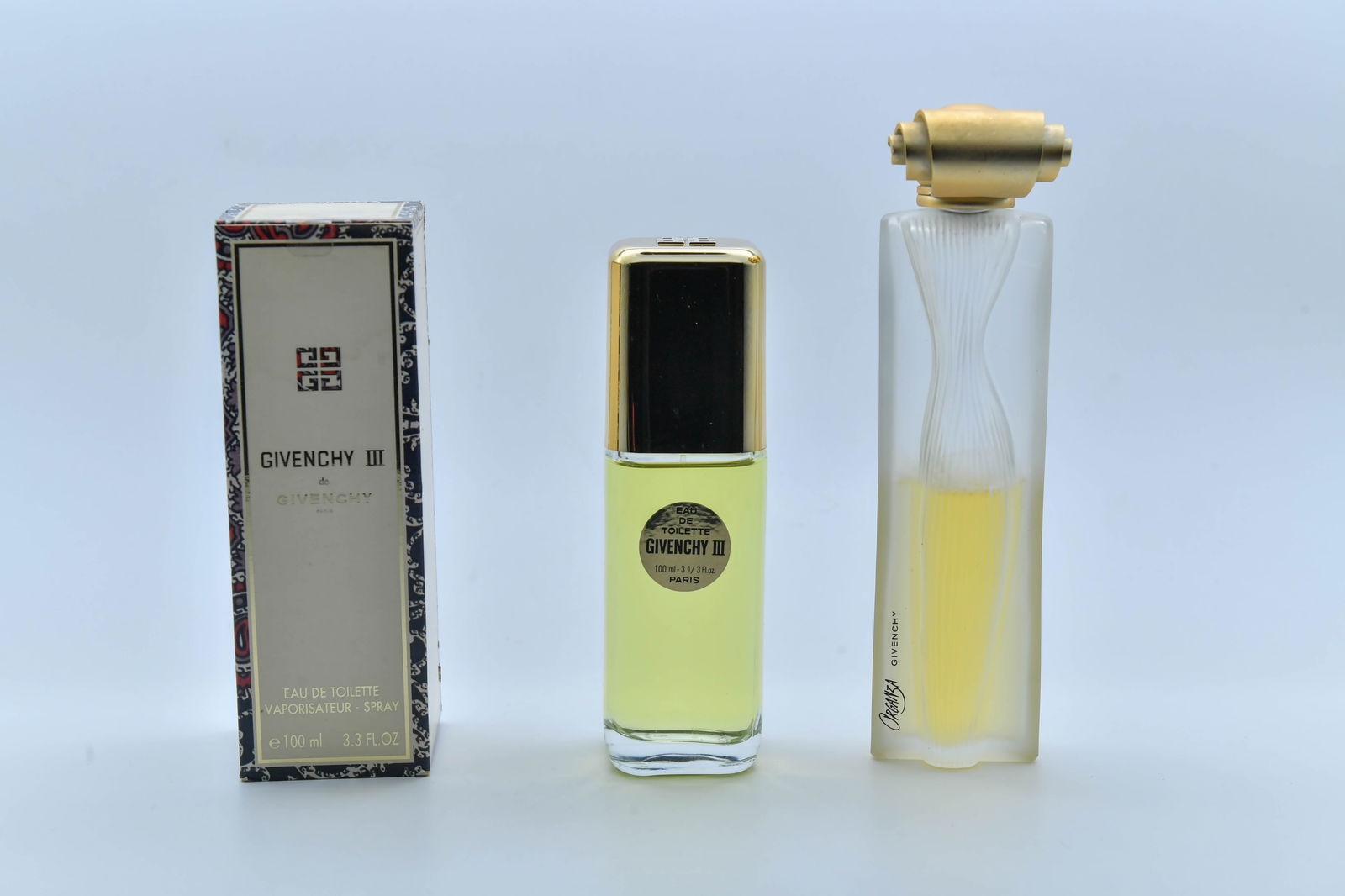 Two Bottles of Givenchy Perfume, Made in France: Two Bottles of Givenchy Perfume. 1)Givenchy III Eau de Toilette spray, 100ml, Fully with original box; 2)Givenchy Organza Eau de Perfume, 3.3oz, 1/2 full, no box.