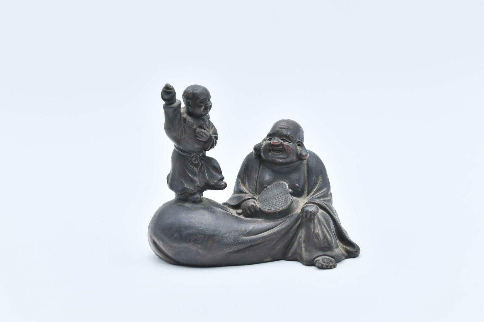 Vintage Chinese/Japanese Purple Clay Sculpture - Laughing Buddha & A Child Figure: Vintage Chinese/Japanese Purple Clay Sculpture - Laughing Buddha & A Child Figure. Measures approx. 6"1/2L x 3"1/2W x 5"1/2H; In good condition.