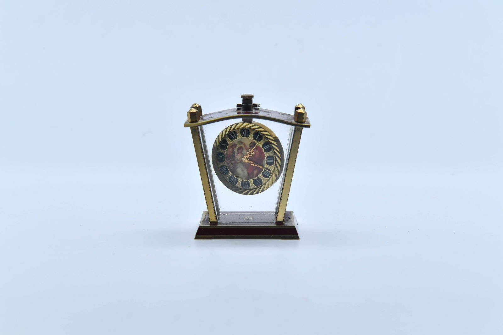 Rare Vintage FUTURA WATCH Mini Enamel Desk Clock: Rare Vintage FUTURA WATCH Mini Enamel Desk Clock. It features a small and gold-toned carriage clock design with a decorative dial, brass frame and gilded finish. Height 2", Vintage condition with norm