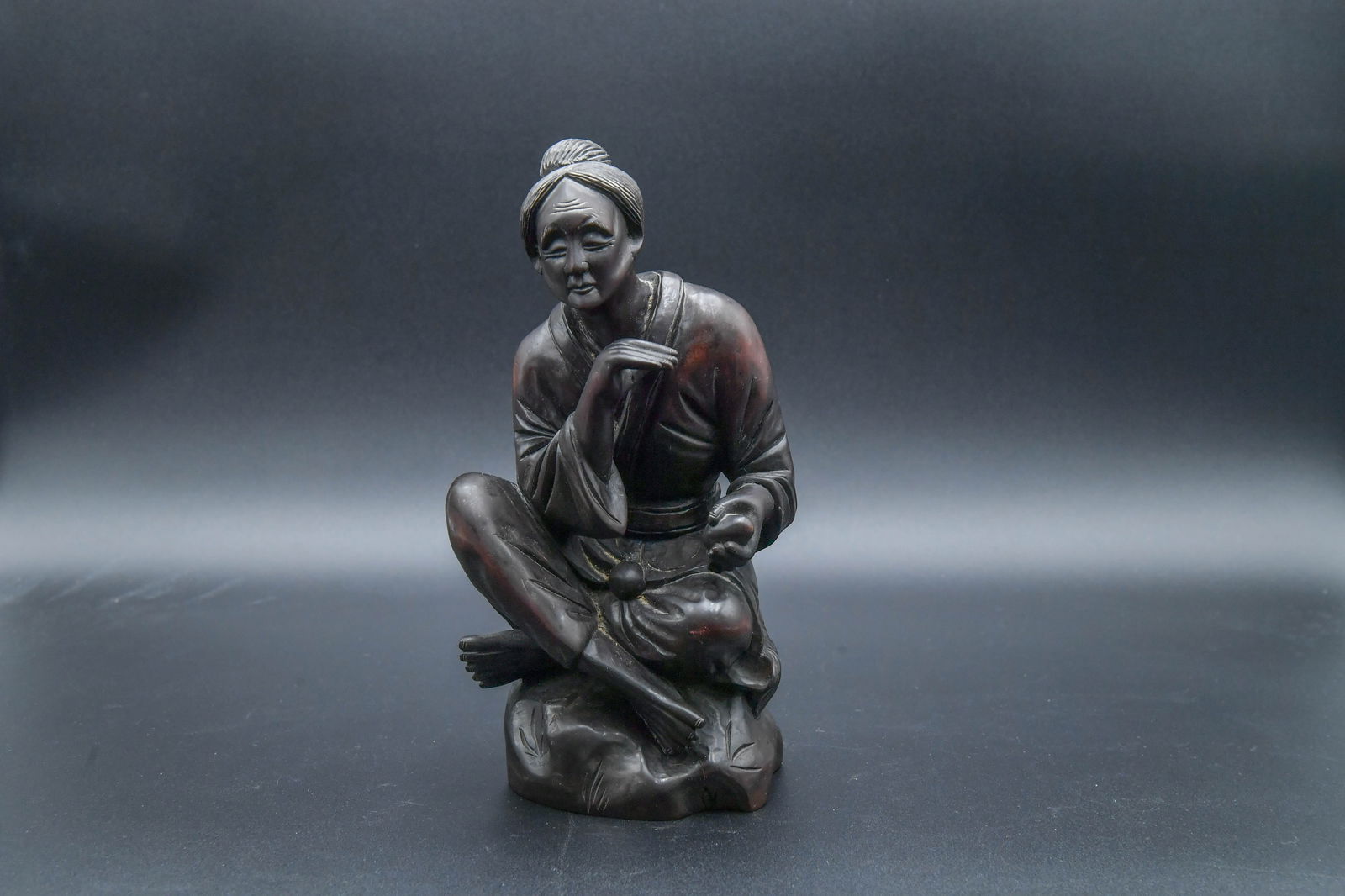 Vintage Japanese Hand-Carved Wooden Okimono Sitting Figure Statue: Vintage Japanese Hand-Carved Wooden Okimono Sitting Figure Statue. 9"3/4H x 5"1/4W x 4"D; In good condition.