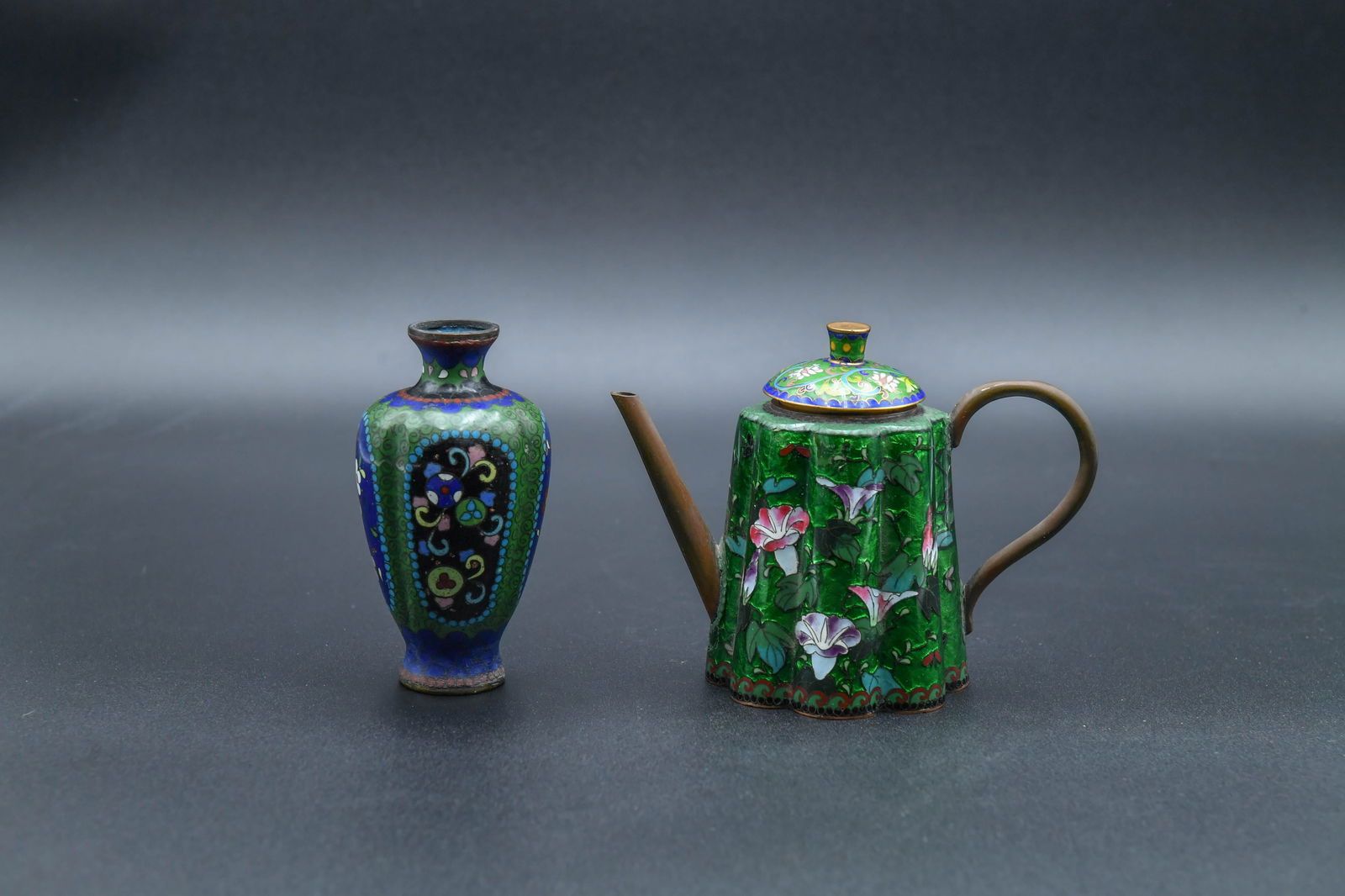 Two Antique Japanese Cloisonne Enamel Water Dropper & Vase: Two Antique Japanese Cloisonne Enamel Water Dropper & Vase. 1)Enamel and lotus flower-shaped over a coper body. Vibrant green background with polychrome floral designs, including morning glories. Size