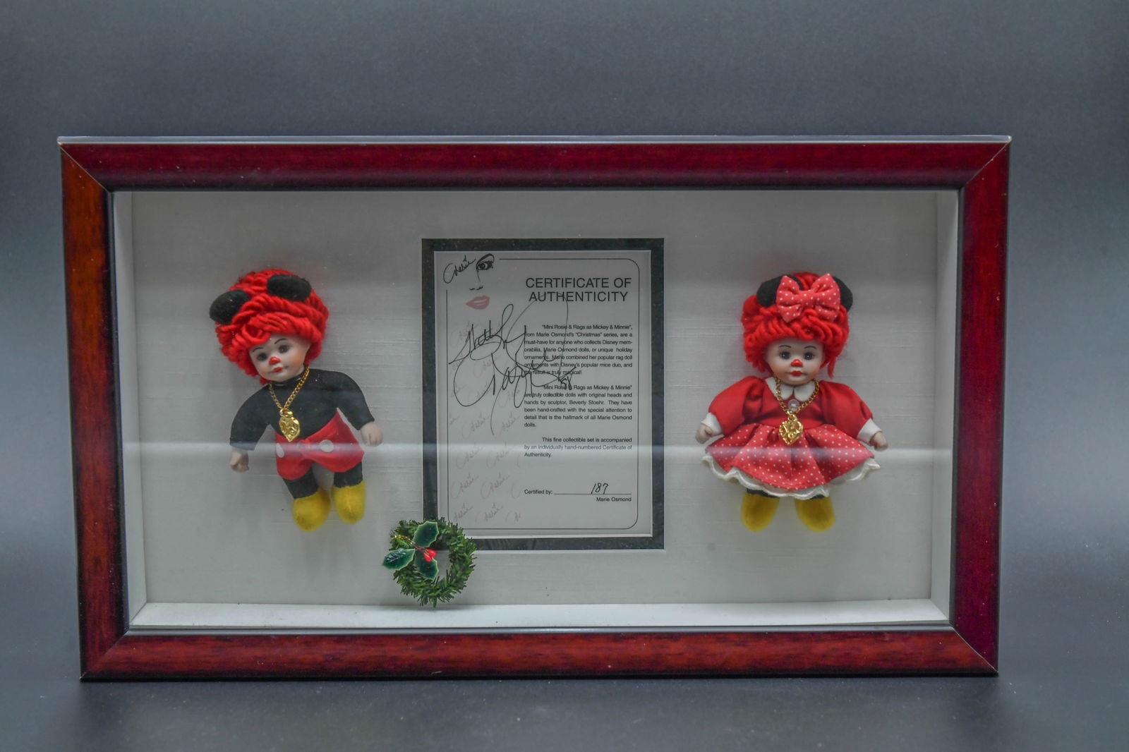 Framed Set of Marie Osmond Mini Rosie & Rags Porcelain Dolls Dressed As Mickey & Minnie Mouse: Framed Set of Marie Osmond Mini Rosie & Rags Porcelain Dolls Dressed As Mickey & Minnie Mouse. The set includes a Certificate of Authenticity and they are signed by Marie Osmond. Certified by 187. Fra