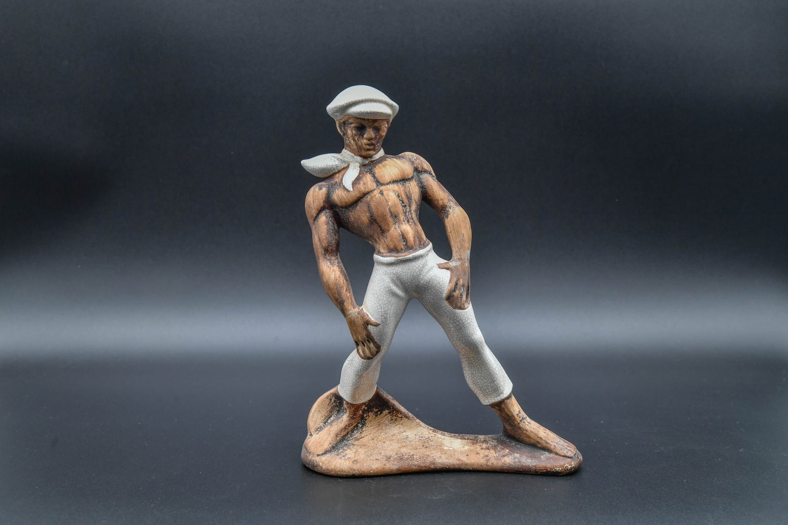 Vintage Ceramic Male Sailor Figurine Statue: Vintage Ceramic Male Sailor Figurine Statue. Measures approx. 10"H x 7"1/2L x 3"1/4D; Overall in good condition, with a minor hairline crack to the wrist.