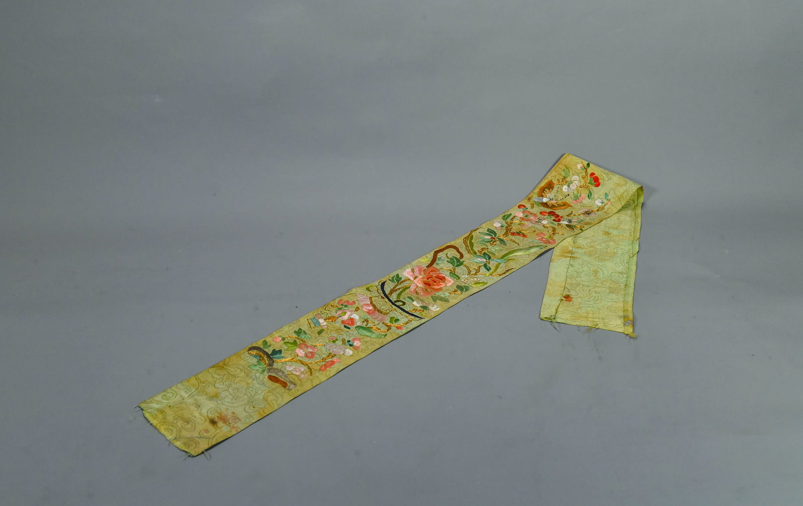 Fine Antique Chinese Silk Embroidered Textile Panel: Fine Antique Chinese Silk Embroidered Textile Panel. 36" x 3"3/4; Due to its age, the silk foundation shows areas of darkening, a common characteristic of historic textiles. The embroidered floral mot