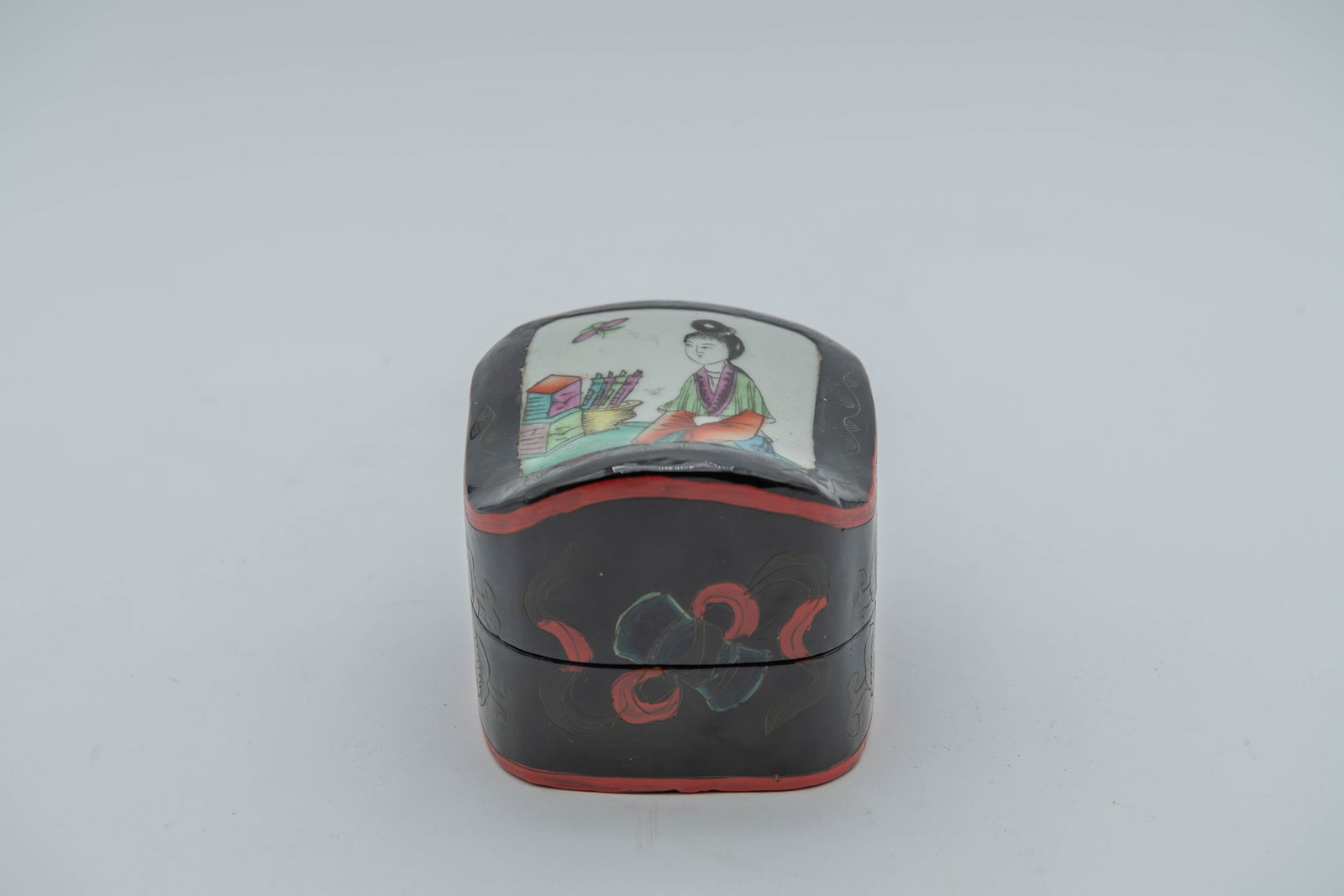 Vintage/Antique Chinese Porcelain Shard Lacquer Jewelry Box: Vintage/Antique Chinese Porcelain Shard Lacquer Jewelry Box. It features a hand-painted porcelain top depicting a figure in garden scene. The side are traditionally made of lacquered wood. Measures 4"